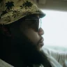 A CDL driver with bucket hat and sunglasses drives back to Galveston, Texas