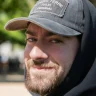 A bearded man from Lubbock, Texas smiles after he completes his RTD program
